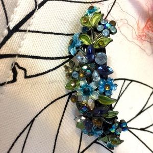 Vintage barrette. Blue and green rhinestones. Heavy and well constructed.